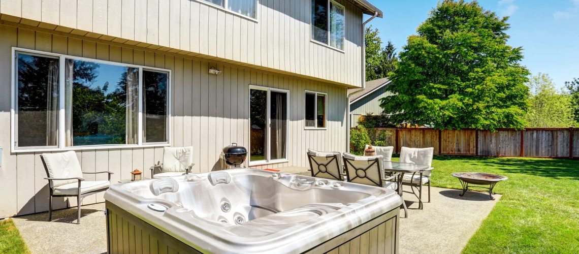 Backyard,Concrete,Floor,Patio,Area,With,Hot,Tub.,Well,Kept